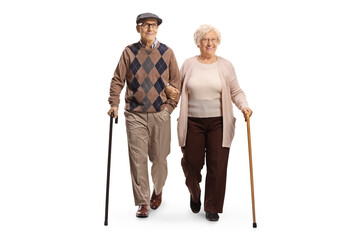 Full length portrait of an elderly man and woman walking with canes towards camera