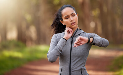 Poster - That run did exactly what it was supposed to do. Shot of a woman feeling her pulse while checking her watch.