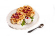 Homemade freshly baked belgian waffles with mascarpone, mint leaves and strawberry sauce isolated on white background.