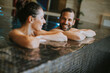 © BGStock72 - Young couple relaxing in a swimming pool