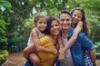 © Koegelenberg/peopleimages.com - Mom, dad and their two little angels. Cropped portrait of a happy family spending some time together at the park.