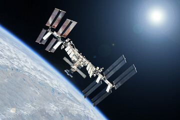 Wall Mural - iss above the earth's surface. elements of this image furnished by nasa