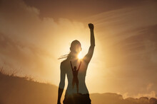 Strong Young Woman With Fist Up On A Mountain. Never Give Up, And People Power Concept. Double Exposure 