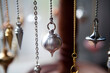 Pendulums being used for the exercise of the trade of healer dowser.