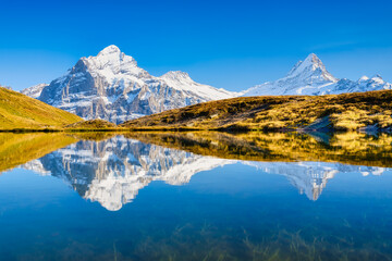 Wall Mural - high mountains and reflection on the surface of the lake. mountain valley with lake. landscape in th