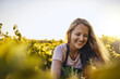 © Lyndon Stratford/peopleimages.com - She knows her plants. Shot of a young woman tending to her crops on a farm.