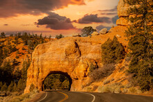 Red Rock Canyon, Near Bryce NP.  Utah Highway 12 Passes Through A Natural Bridge In The Orange Red Limestone Rocks.