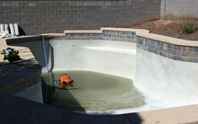 Residential Pool Being Drained And Cleaned 