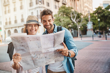 Sticker - We both love exploring our surroundings. Shot of a happy couple using a map while exploring a foreign city.