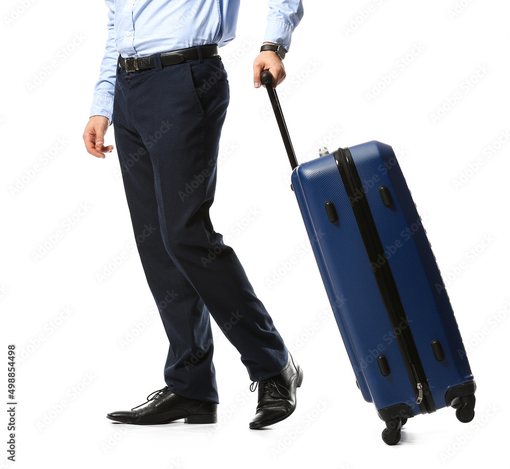 Young businessman with blue suitcase on white background