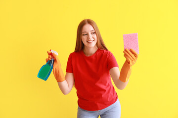 Wall Mural - Young woman with sponge and detergent on color background