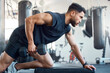 © Nicholas Felix/peopleimages.com - A bad day can be made better by going to the gym. Shot of a sporty young man exercising with a dumbbell in a gym.
