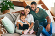 © Nicholas Felix/peopleimages.com - Sharing in the cutest connection. Shot of a happy family using a digital tablet together at home.