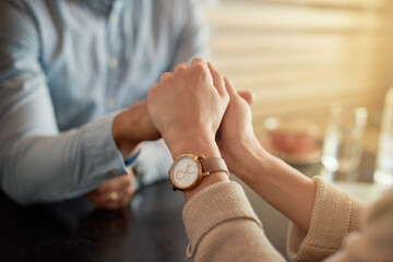 Sticker - My hand in yours forever. Shot of an affectionate young couple holding hands while sitting in a cafe.