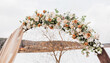 © Daria Lukoiko - Wedding round arch with flowers and fabric in spring or winter. The place of the bride and groom for the ceremony in nature