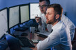 © standret - Money investment. Two stock traders working in the office with exchange technology