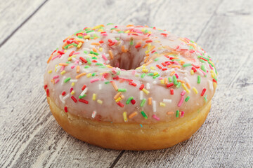 Sweet glazed vanilla donut with icing