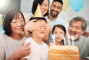 Poster - Every age can be enchanting, provided you live within it. Shot of a boy having his eyes covered at a birthday party at home.