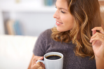 Sticker - Coffee contemplations.... Shot of a young woman having coffee at home.