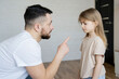 © Julija - Domestic violence concept. father explains how to behave to the child. Focus on men.