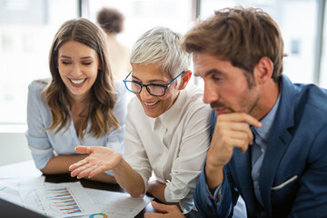 Group of multiethnic successful business people working and communicating at the office