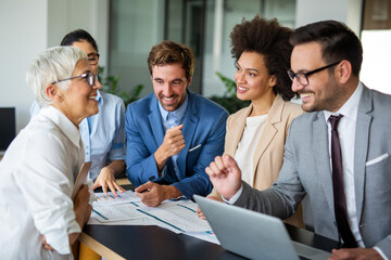 Wall Mural - Success group of multiethnic entrepreneurs and business people achieving goals in corporate office