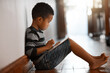 © Nikish Hiraman/peopleimages.com - Theres an app for everyone. Full length shot of a young boy using his digital tablet while sitting on the floor at home.
