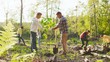 © ihorvsn - Caucasian man and woman environmental volunteers planting trees together and with multicultural people at the background. Reforestation concept