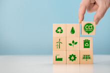 Net Zero And Carbon Neutral Concept. Put Wooden Cubes With Green Net Zero Icon. CO2 Net-Zero Emission -Carbon Neutrality Concept. Renewable Energy, Co2 Emissions Reduction, Green Production