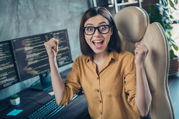 Poster - Portrait of attractive cheerful crazy lucky girl rejoicing having fun developing web project at workplace workstation indoors