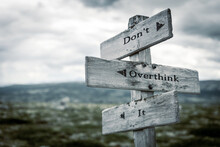 Dont Overthink It Text Quote Written In Wooden Signpost Outdoors In Nature. Moody Theme Feeling.
