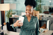 © Graham F/peopleimages.com - Im feeling extra confident today. Shot of a young businesswoman taking selfies in an office.