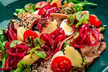 Wall Mural - Beef tongue salad with fresh vegetables, pickled onions and mini corn