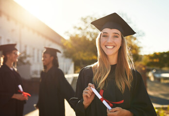 Poster - The dream is now a reality. Portrait of a happy young woman holding a diploma on graduation day.