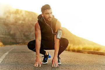 Sticker - Hes ready to run. Shot of a young man exercising outdoors.