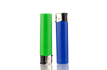 Two colored lighters, macro, isolated on a white background.