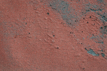 grunge texture of building wall covered by aged and weathered roofing material