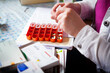 © RFBSIP - Nurse preparing the pillbox for her patient.