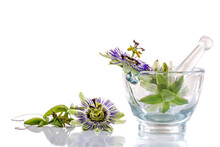 Image Of Passionflowers In A Glass Mortar Isolated On White Background.