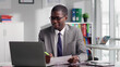 © TommyStockProject - African-American lawyer having online meeting with client using laptop
