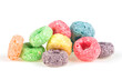 Delicious and nutritious fruit cereal loops isolated on a white background. Sweetened corn cereals. Healthy breakfast.