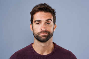 Aufkleber - I cant be bothered. Studio shot of a handsome young man looking bored against a gray background.