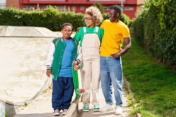 african american family with son in the yard of the house