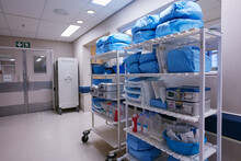 Organization Is Essential To Running A Hospital. Shot Of Shelves Stocked With Medical Supplies In An Empty Hospital Ward.