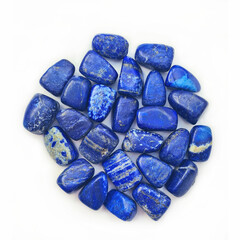 Closeup of a pile of Lapis Lazuli gemstones isolated on white background