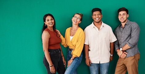 Poster - Optimism is a strategy for making a better future. Portrait of a group of young designers standing together against a green background.