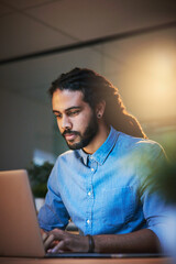Aufkleber - Hard work and determination are the keys to success. Cropped shot of a young designer working late on a laptop in an office.