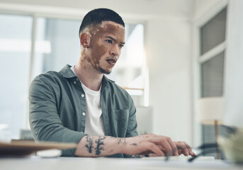 Opportunities dont happen. You create them. Shot of a young business man working in a modern office.