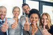 © Nikish Hiraman/peopleimages.com - Youre doing great as long as youre giving your best. Portrait of a group of businesspeople showing thumbs up together in an office.