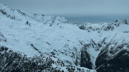 Wall Mural - 4k aerial of tantalus range in the coast mountains in late winter, british columbia, canada
